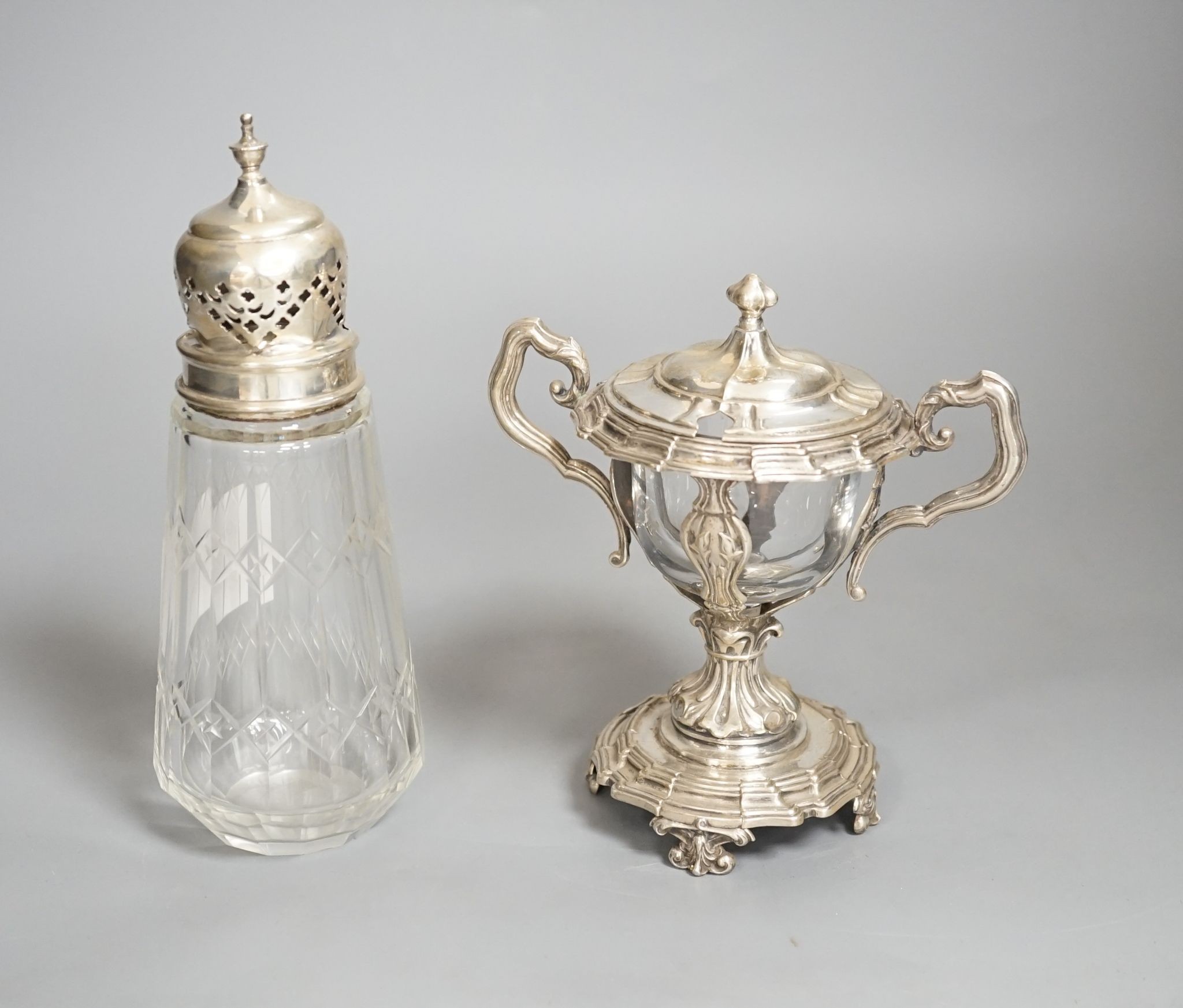 A George V silver mounted glass caster and a continental silver mustard pot frame (the latter a.f)